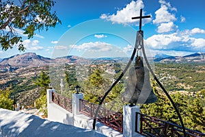 Bronze bell with cross on wall of Tsambika Monastery, RHODES, G