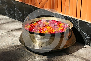 Bronze bowl with rose petals