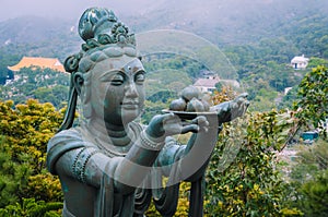 Bronze buddhistic statues praising and making offerings to the Tian Tan Buddha - Big Buddha