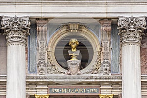 Bronze busts of Mozart on front Facade Opera