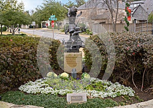 Bronze of Children playing with Birds in Elena`s Childrens Park at Christmas in University Park, Texas