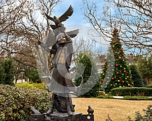 Bronze of Children playing with Birds in Elena`s Childrens Park at Christmas in University Park, Texas