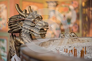 Bronze Chinese Dragon near the bowl