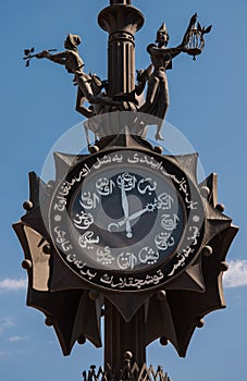 Bronze composition with the clock set at the beginning of Bauman street in Kazan