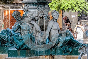 Bronze divinity statues in the fountain