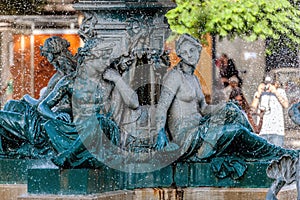 Bronze divinity statues in the fountain photo
