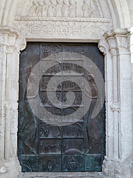 A bronze door with bible scenes