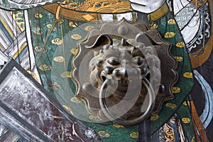 Bronze door knobs in a temple