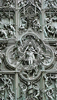 Bronze door of Milan Cathedral, Italy photo