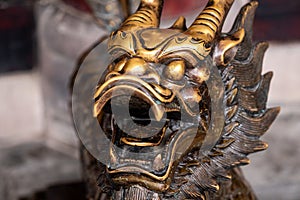 Bronze dragon statue in a chinese buddhist temple