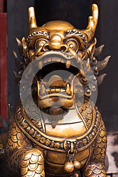 Bronze dragon statue in a chinese buddist temple