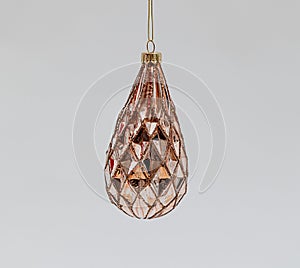 Bronze drop-shaped Christmas tree toy with rhombus concave patterns