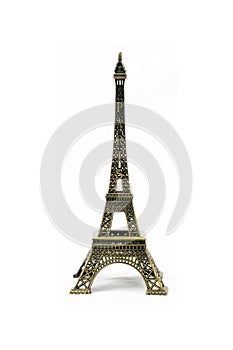 Bronze Eiffel Tower toy isolated on white background
