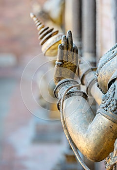 Bronze elegant hands of Buddha statue in Patan Durbar Square royal medieval palace and UNESCO World Heritage Site. Lalitpur, Nepal photo