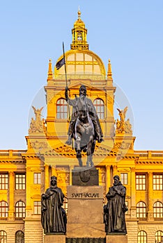 The bronze equestrian statue of St Wenceslas at the Wenceslas Square with historical Neorenaissance building of National photo