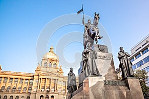 The bronze equestrian statue of St Wenceslas at the Wenceslas Square with historical Neorenaissance building of National photo