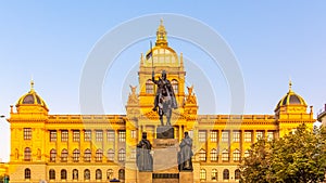 The bronze equestrian statue of St Wenceslas at the Wenceslas Square with historical Neorenaissance building of National photo