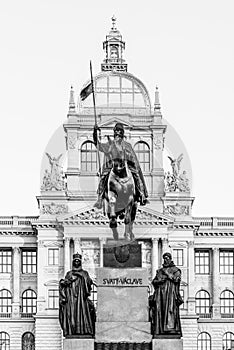 The bronze equestrian statue of St Wenceslas at the Wenceslas Square with historical Neorenaissance building of National photo