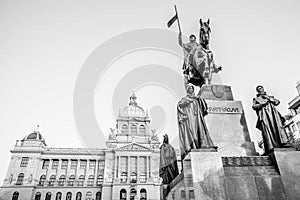 The bronze equestrian statue of St Wenceslas at the Wenceslas Square with historical Neorenaissance building of National photo