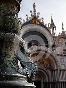 Bronze figure in front of Saint Marks Basilica in Venice