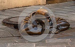 Bronze sculpture called Cumil -The Watcher, or Man at work, Bratislava, Slovakia