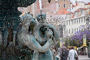 Bronze fountain at Rossio square in Lisbon