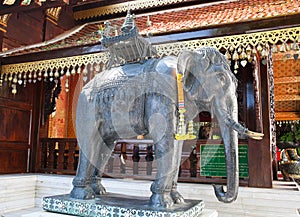 Bronze holy elephant statue at the side wall of Vihara at Wat Phra That Doi Suthep in Chiang Mai, Northern Thailand