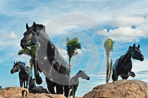 Bronze horses in tropical location