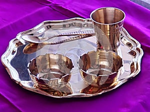 selective focus view of Bronze, Kansa utensil set designed for Babies