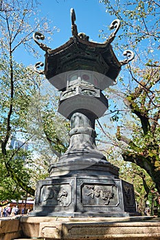 The bronze lantern in the garden of Yasukuni Shrine in Chiyoda, Tokyo. Japan