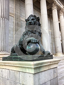 Bronze lion in front of financial building