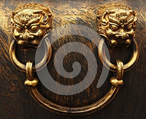Bronze lion heads. Forbidden City in Beijing