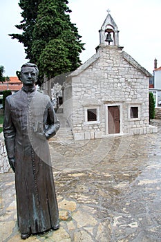 Bronze monk and church