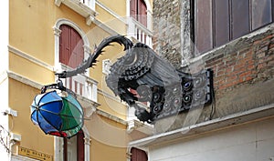 bronze ornate street lamp in the shape of a dragon, Venice, Italy