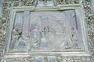 Bronze panel detail of the entrance door of Pisa Cathedral photo