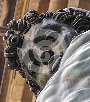 Bronze Perseus Statue Close Up Face Gazes Down at Camera