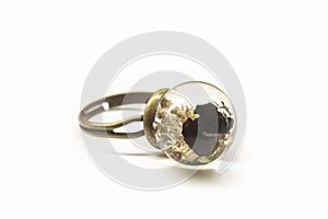 Bronze ring with moss and lava rock