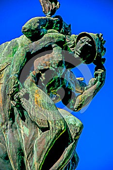 Bronze sculpture with blue sky