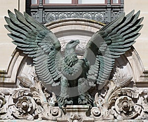 Bronze sculpture of a French Napoleonic imperial eagle above the door of Palais Garnier, Paris photo