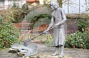 Bronze sculpture of a worker