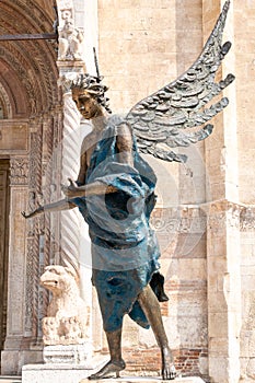 Bronze statue The Blue Angel of Acceptance, or Hospitality, by Albano Poli in front of the cathedral, Verona, Italy