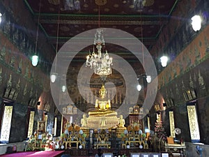 Bronze statue of Buddha in Thai Temple, Bangkok photo