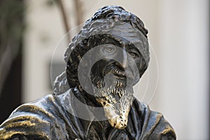 Head of bronze statue of El Caballero de Paris with shiny beard at Square Francis Assisi, Cuba photo