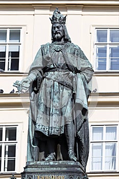 Bronze statue of the eleventh Czech King and Roman Emperor Charles IV. in night snowy Prague near Charles Bridge, Czech Republic