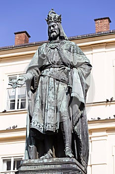 Bronze statue of the eleventh Czech King and Roman Emperor Charles IV. in night snowy Prague near Charles Bridge, Czech Republic