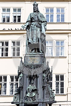 Bronze statue of the eleventh Czech King and Roman Emperor Charles IV. in night snowy Prague near Charles Bridge, Czech Republic