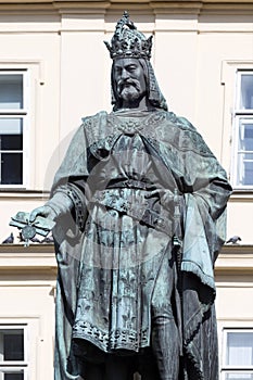 Bronze statue of the eleventh Czech King and Roman Emperor Charles IV. in night snowy Prague near Charles Bridge, Czech Republic