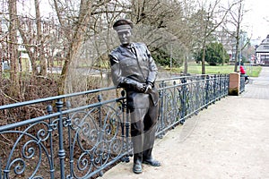 Bronze statue of Elvis Presley, on the pedestrian bridge over the Usa river in the Kurpark, Bad Nauheim, Germany photo