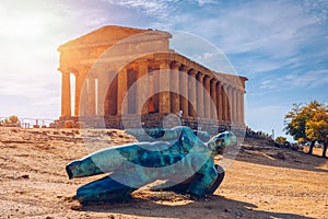 Bronze statue of Icarus in front of the Temple of Concordia at the Valley of the Temples. Temple of Concordia and the statue of