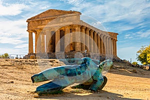 Bronze statue of Icarus in front of the Temple of Concordia at the Valley of the Temples. Temple of Concordia and the statue of